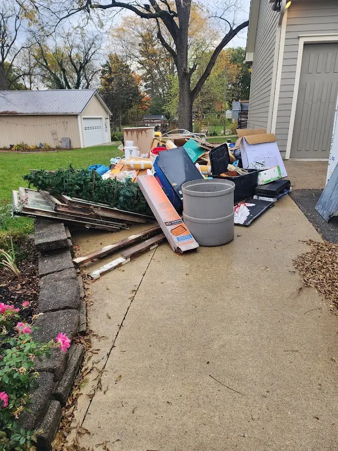 Dumpster being loaded with debris for Commercial Dumpster Rental in Fremont